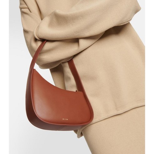 Combining style and functionality, the Half Moon Small leather shoulder bag is a must-have accessory for any fashion enthusiast.